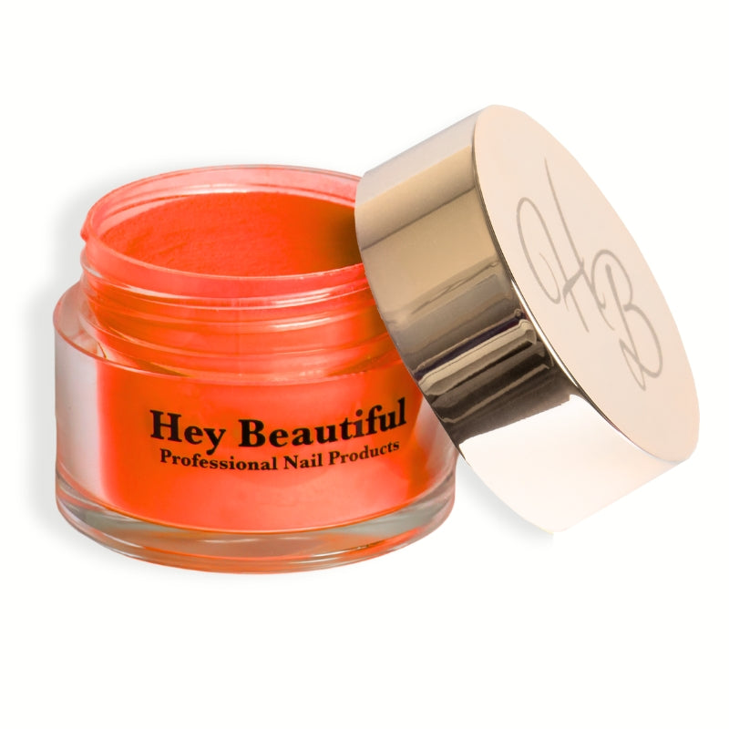 Jar of Bright Orange Acrylic Powder with Hey Beautiful’s iconic champagne-colored logo on the cap, emphasizing the premium packaging.