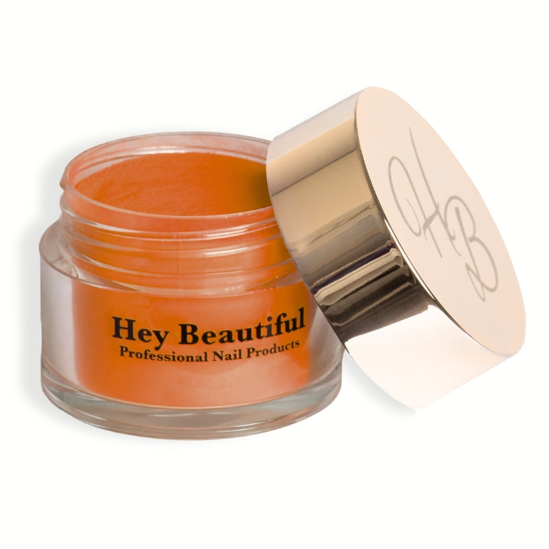 Jar of Pure Orange Acrylic Powder with Hey Beautiful’s iconic champagne-colored logo on the cap, showcasing its vibrant orange color packaging.