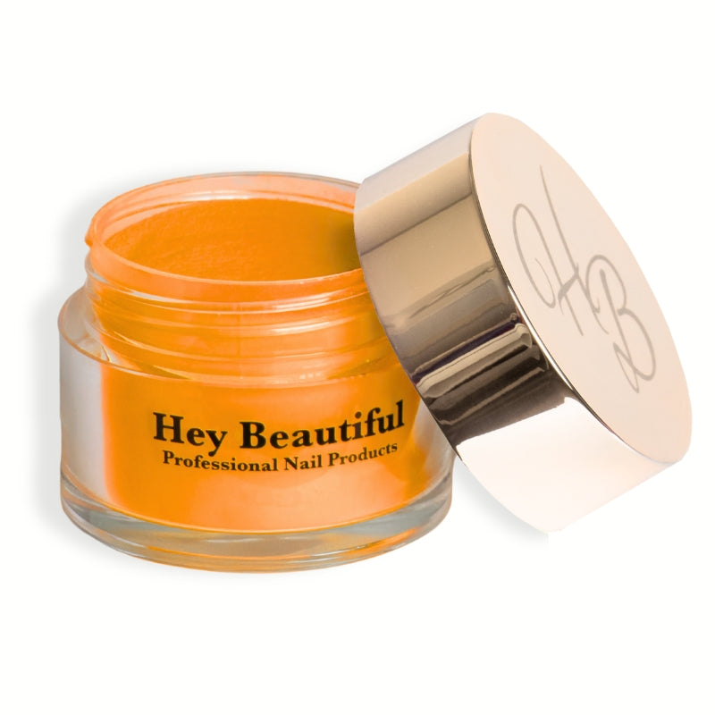 Jar of Mango 2.0 Acrylic Powder featuring Hey Beautiful’s iconic champagne-colored logo on the cap, highlighting its stylish packaging.