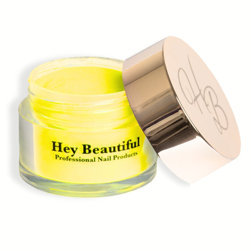 Jar of Neon Yellow Acrylic Powder with Hey Beautiful’s iconic champagne-colored logo on the cap, showcasing its bright and bold packaging.